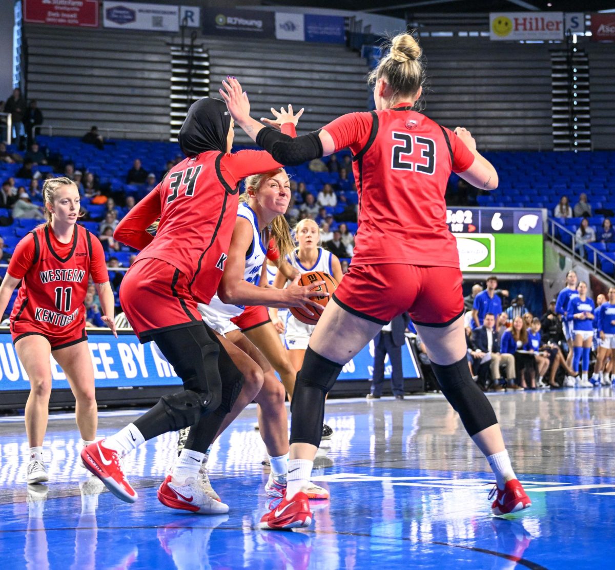 MTSU guard Macie Phifer fights through defenders in the paint during a game against Western Kentucky, inside the Murphy Center on Jan. 31, 2026.