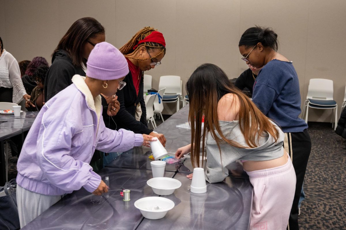 Students assemble waist beads at the Student Union Building, Feb. 18, 2026.