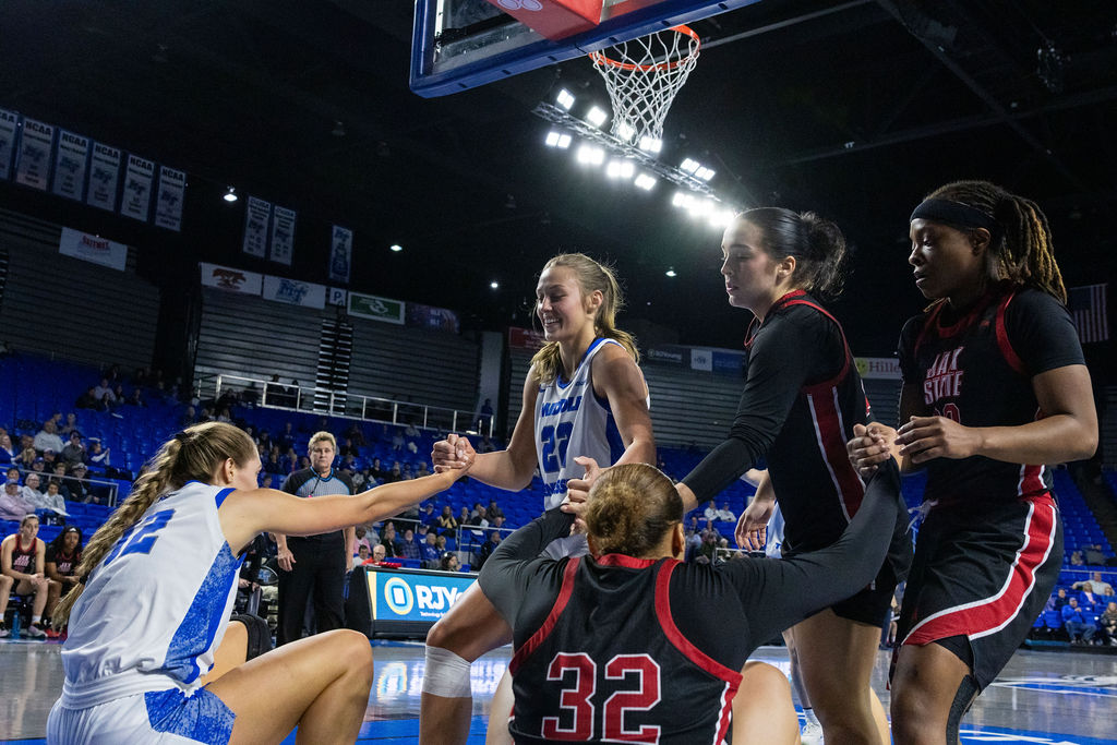 Macie Phifer helps up Blair Baugus along with Brooklyn McDaniel aided by two Jax State Players in Murfreesboro, Tennessee, on February 13, 2026 