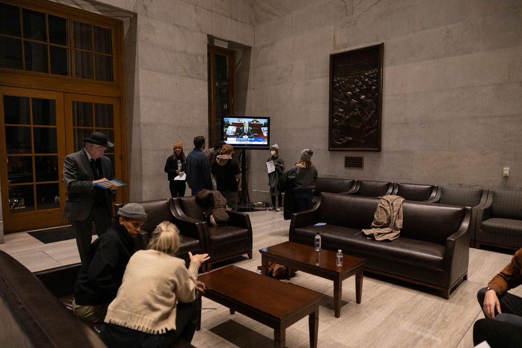 Protestors watch the State of State address outside of the House chamber of the Capitol in Nashville, Tennessee on Feb. 2, 2026. 