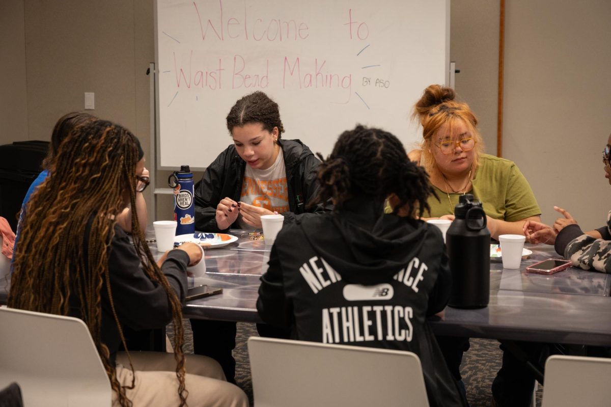 Students assemble waist beads at the Student Union Building, Feb. 18, 2026.