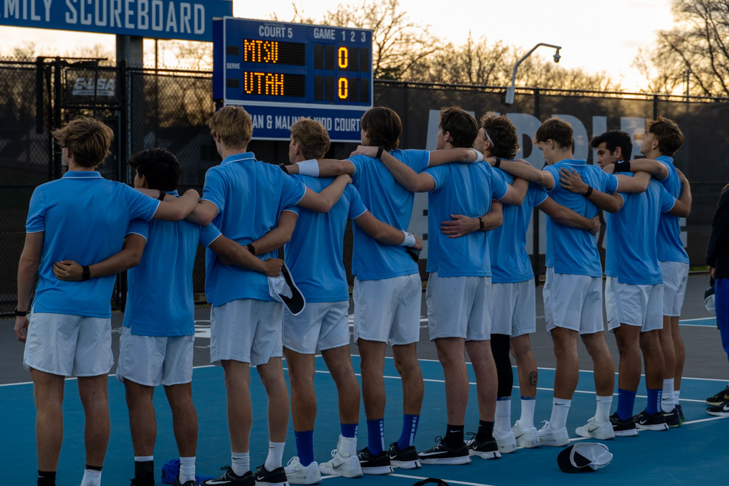 The MTSU men's tennis team stands together for the National Anthem at the
MTSU outdoor tennis complex on Feb. 20, 2026.