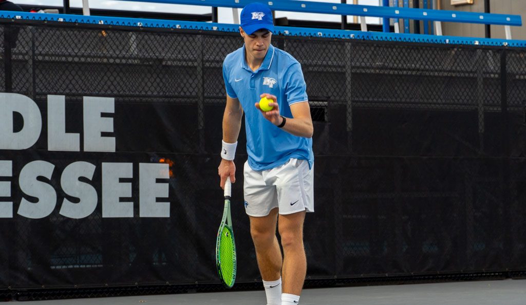 Jonasz Dziopak prepares to serve at the MTSU outdoor tennis complex on Feb. 20, 2026. 