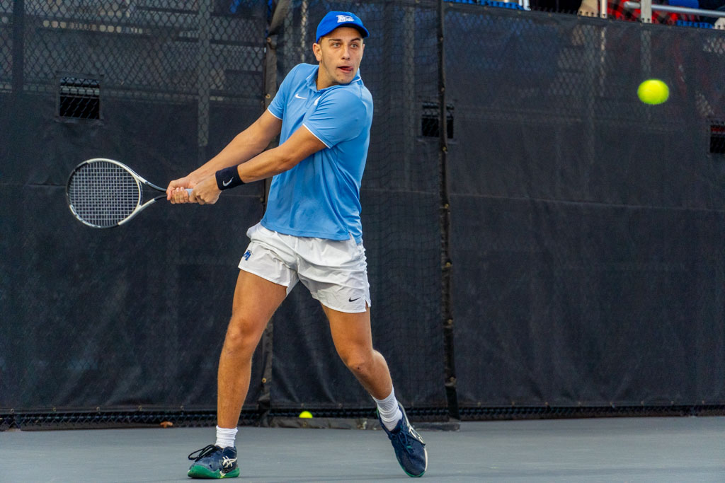 Eric Crivei returns a volley with a backhand at the MTSU outdoor tennis complex on Feb. 20, 2026. 