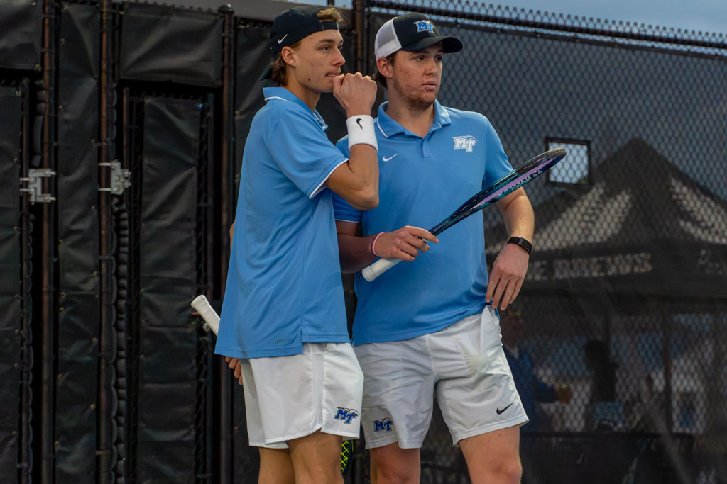 Antoine Mayoral and Houston Jacques discuss strategy before a point at the MTSU outdoor tennis complex on Feb. 20, 2026. 