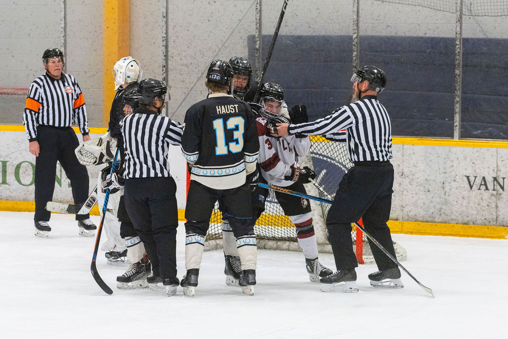 Officials separate MTSU forward Nick Haust (left) and USC defenseman Lukas Tafe (right) during a game against South Carolina, on Feb. 6, 2026, inside the Ford Ice Hockey Center in Antioch, Tennessee. 
