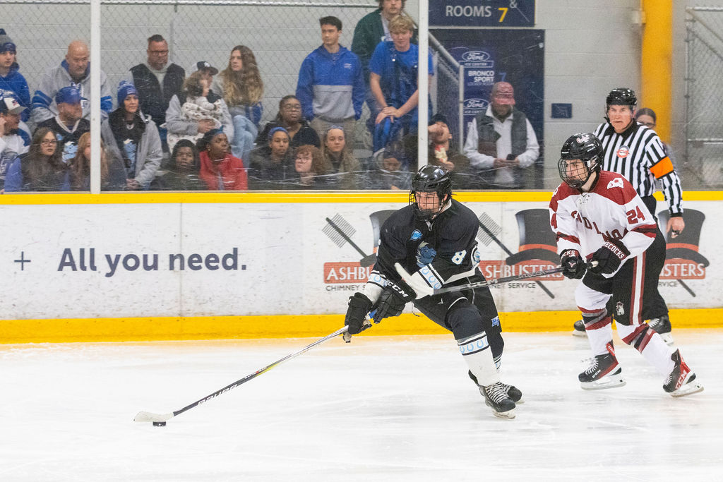 MTSU forward Kieran Ogle(left) protects the puck from USC defenseman Liam Forrest (right) during a game against South Carolina, on Feb. 6, 2026, inside the Ford Ice Hockey Center in Antioch, Tennessee. 