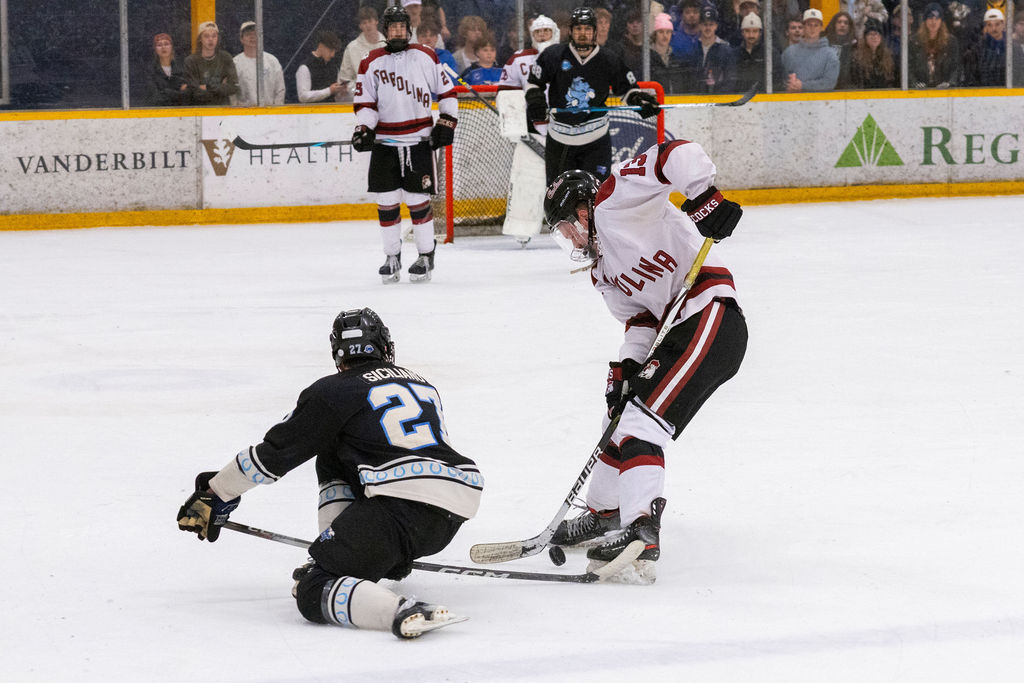 MTSU forward Matthew Siciliano (left) tries to shoot a puck past the stick of USC forward Cameron Snee (right) during a game against South Carolina, on Feb. 6, 2026, inside the Ford Ice Hockey Center in Antioch, Tennessee. 
