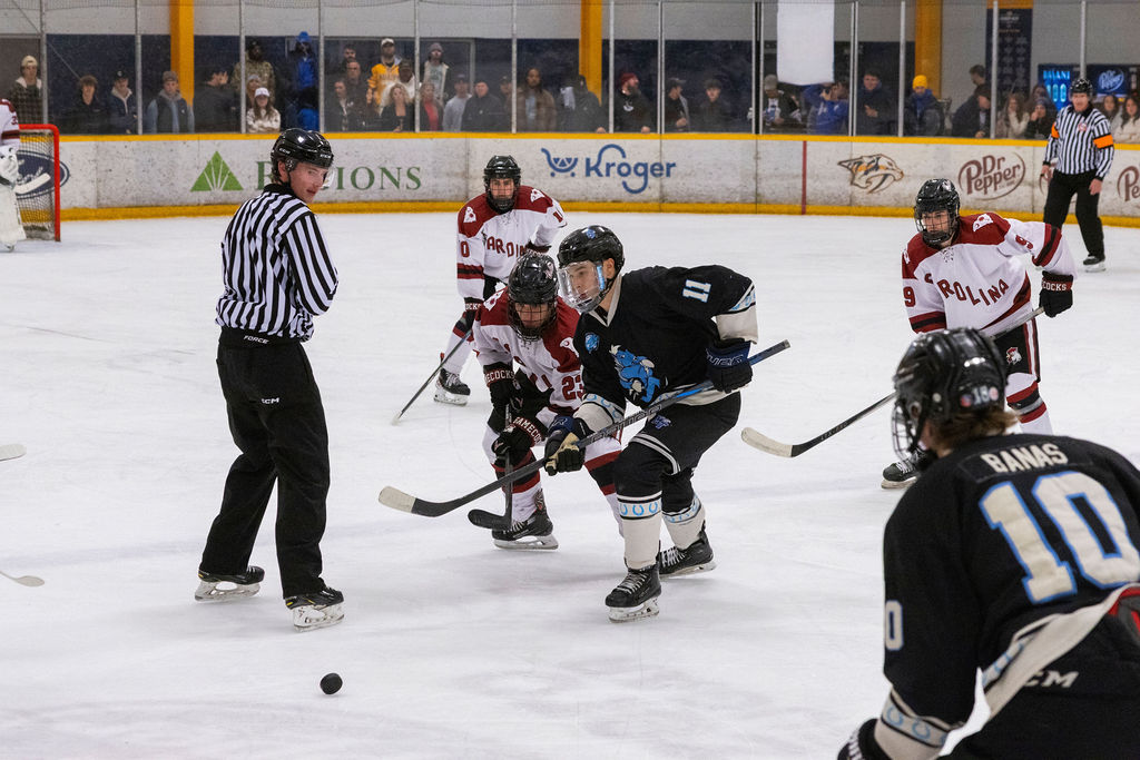 MTSU forward Brendan Ogle (right) and USC forward Micheal Whalen (left) race for the loose puck during a game against South Carolina, on Feb. 7, 2026, inside the Ford Ice Hockey Center in Antioch, Tennessee. 

