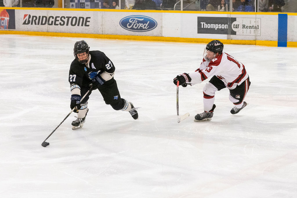 MTSU forward Matthew Siciliano (left) skates past the outstretched stick of USC forward Cameron Snee (right) during a game against South Carolina, on Feb. 7, 2026, inside the Ford Ice Hockey Center in Antioch, Tennessee. 
