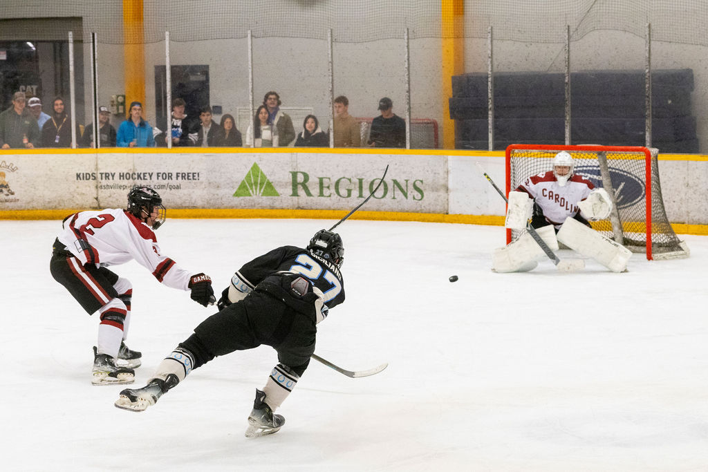 MTSU forward Matthew Siciliano (left) fires a shot towards USC goaltender Drew Durdov (right) during a game against South Carolina, on Feb. 7, 2026, inside the Ford Ice Hockey Center in Antioch, Tennessee. 
