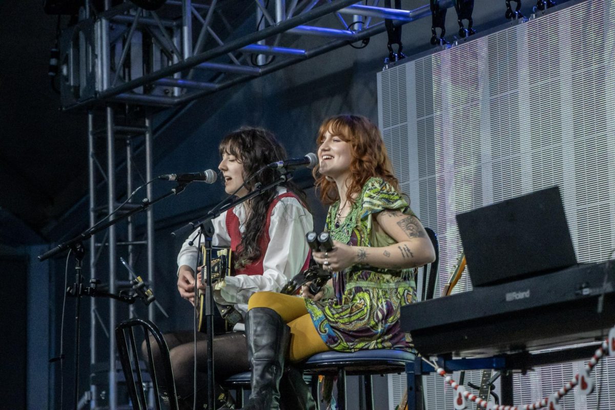 Artists Raven (left) and Sav. (right) singing in the Chris Young Cafe on Feb. 13, 2026.