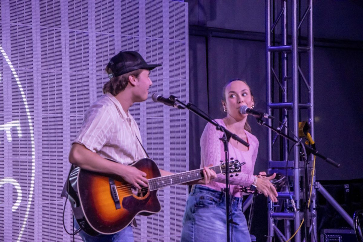 Blank Page duo Jack Robert (left) and Avery Grace (right) singing at the Perfect Match show in the Chris Young Cafe on Feb. 13, 2026.