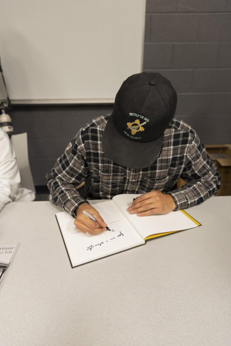 Rahim Fortune signing a book at his artist talk at MTSU on Feb. 3, 2026. 