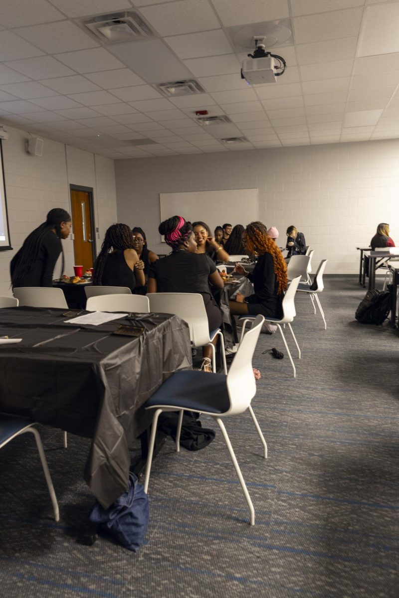 Students mingle at a table during the Seat at the Table Black History event on Feb. 10, 2026.