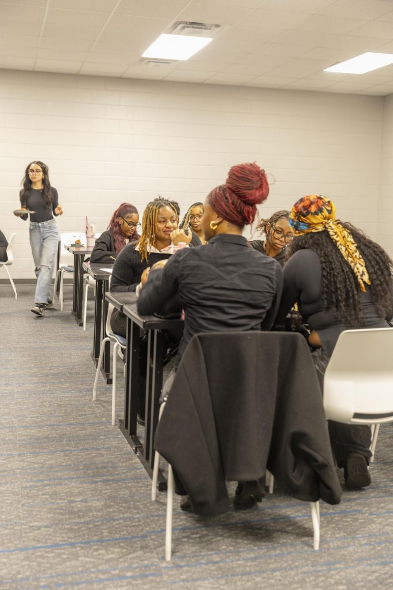 Students eat and talk at their tables during the Seat at the Table Black History event on Feb. 10, 2026.