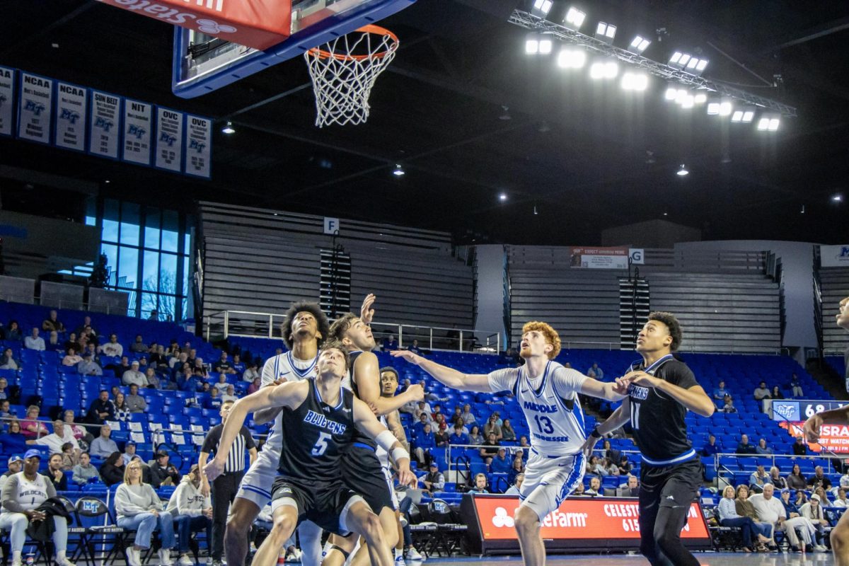 MTSU battles with Delaware at the boards for a rebound in a game at Murphy Center on Feb. 21, 2026.