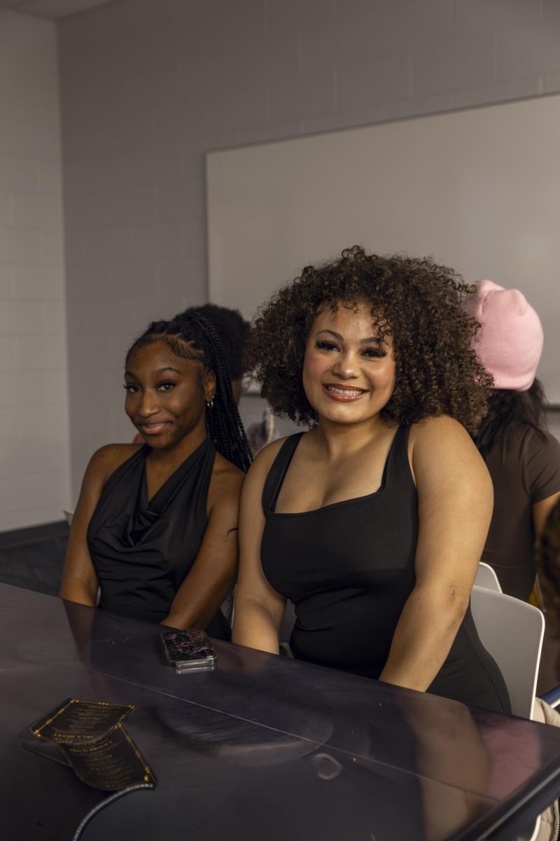 Nyla Terry and Majesty Ford pose for a photo at a table during the Seat at the Table Black History event on Feb. 10, 2026. 