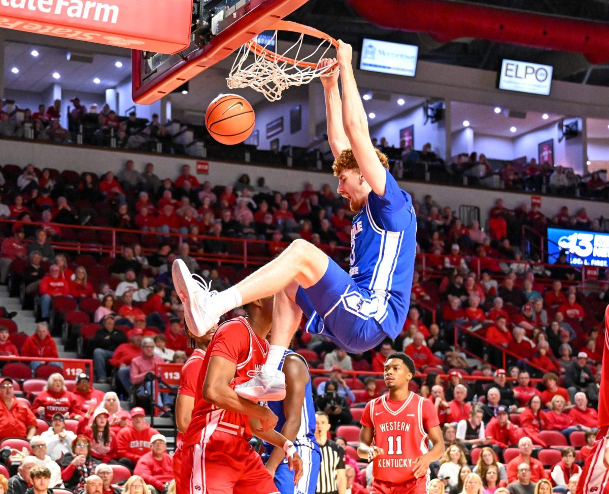 MTSU forward Chris Loofe throws down a two-handed dunk during a game against Western Kentucky, inside E.A. Diddle Arena on Feb. 14, 2026.