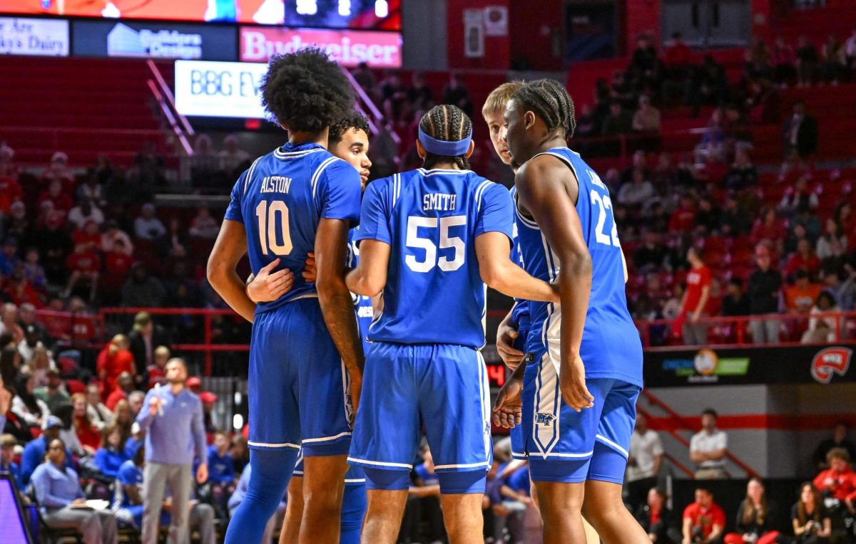 The MTSU five on the floor huddle after a timeout during a game against Western Kentucky, inside E.A. Diddle Arena on Feb. 14, 2026.