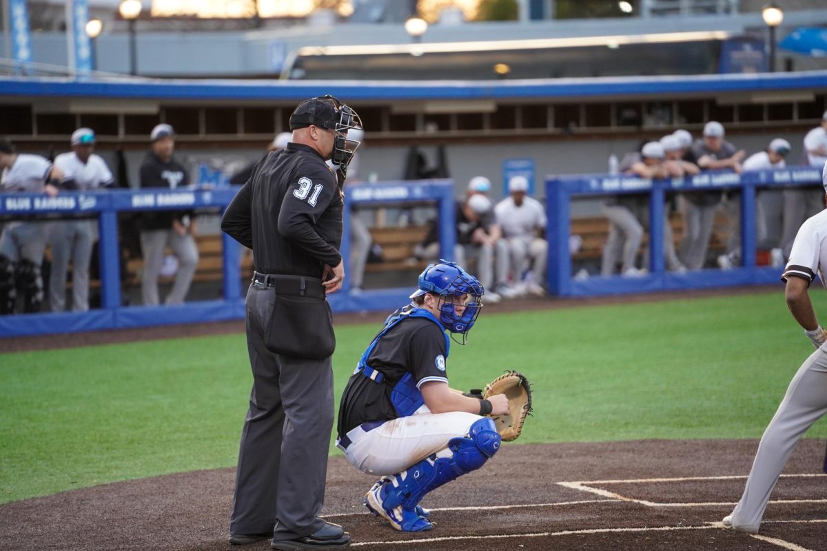 MTSU catcher Tyler Minnick looks toward the dugout to receive a sign from a coach during a game against St. Bonaventure at Reese Smith Jr. Field, Saturday, Feb. 21, 2026.