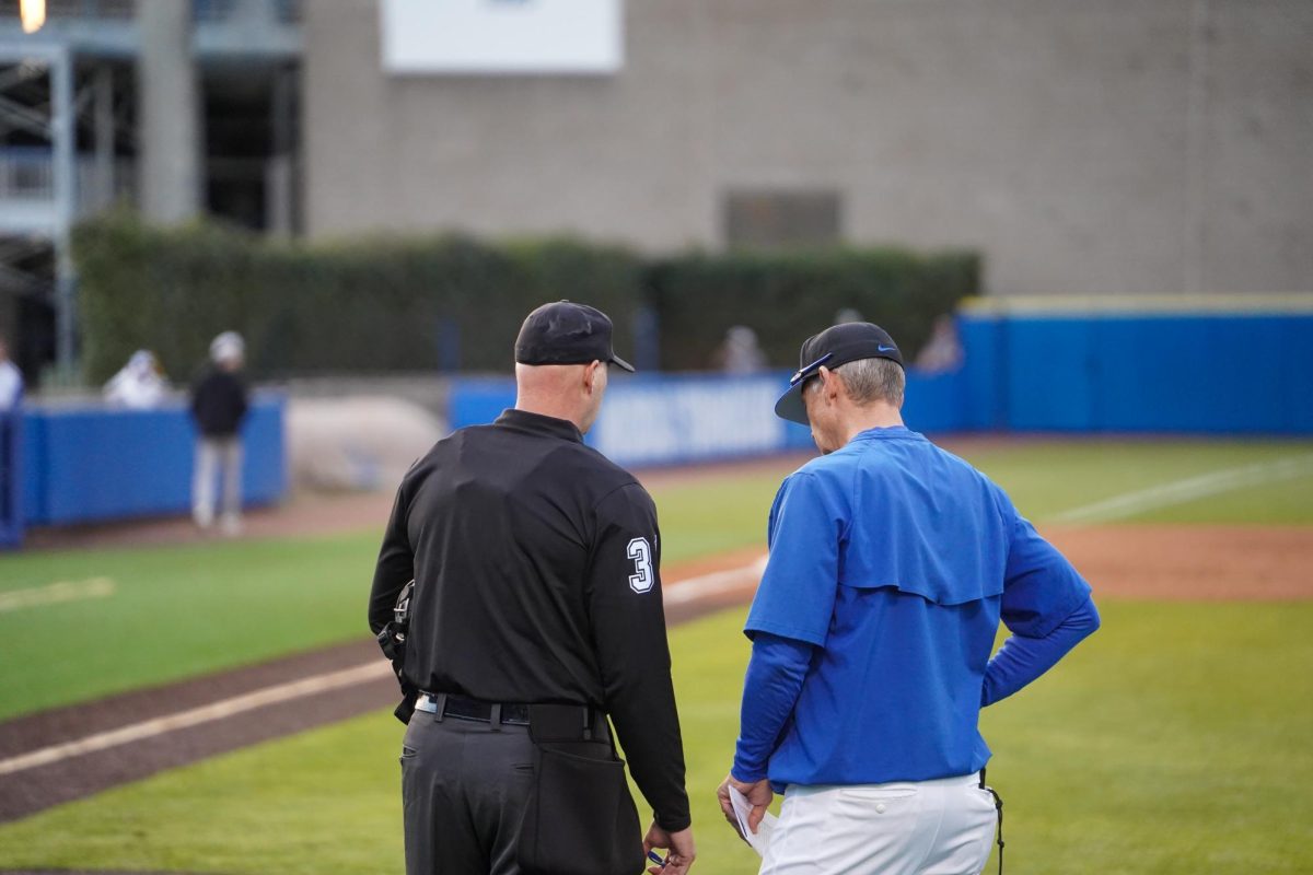 MTSU head coach Jerry Myers talks to an umpire during a game against St. Bonaventure at Reese Smith Jr. Field, Saturday, Feb. 21, 2026.
