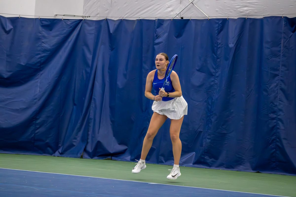 Zora Koenig hops into a return against Northwestern University at the Adams Tennis Complex on Jan. 31, 2026. 