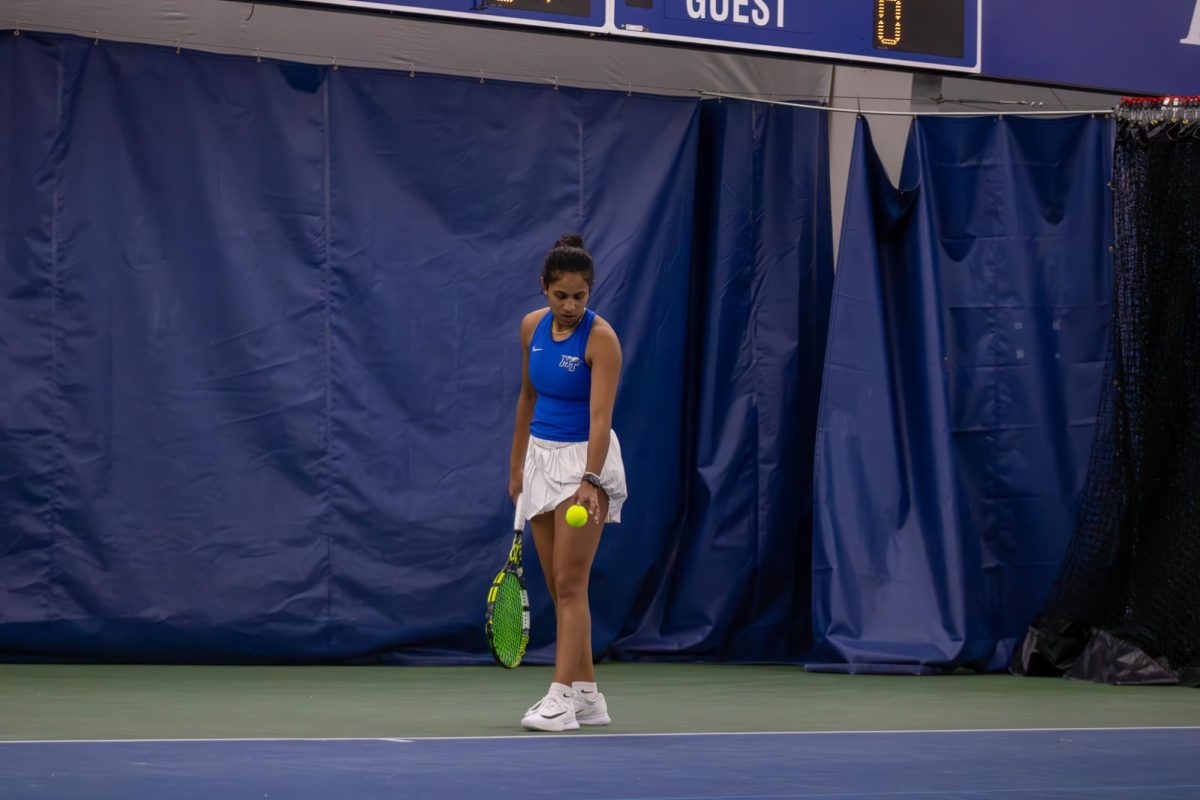 Rutuja Chaphalkar prepares to serve against Northwestern University at the Adams Tennis Complex on Jan. 31, 2026. 