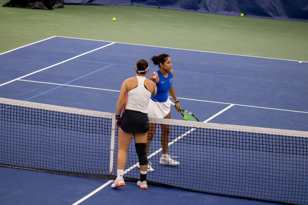 Rutuja Chaphlkar shakes hands with Neena Feldman from Northwestern University at the Adams Tennis Complex on Jan. 31, 2026. 