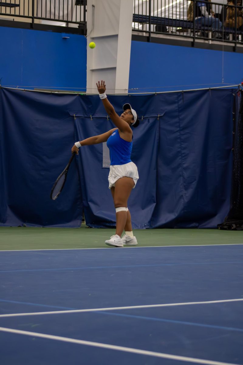 Sthefany Lima starts her serve against Northwestern University at the Adams Tennis Complex on Jan. 31, 2026. 