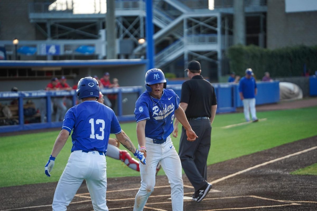 MTSU outfielder Owen Nowak high fives teammate after scoring RBI during a game against Southern Indiana University at Reese Smith Jr field on March 31, 2026.