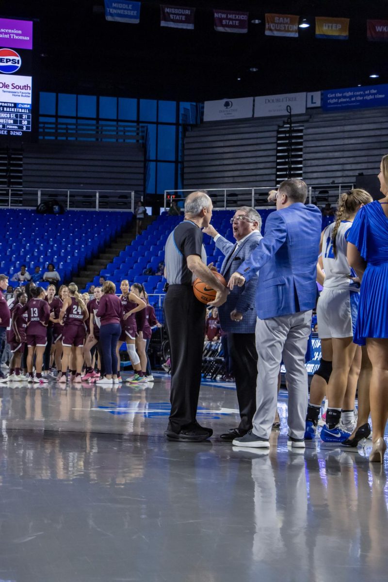 MTSU head coach Rick Insell and associate head coach Matt Insell talking to the referee about a call in a game against Missouri State in the Murphy Center on March 7, 2026.