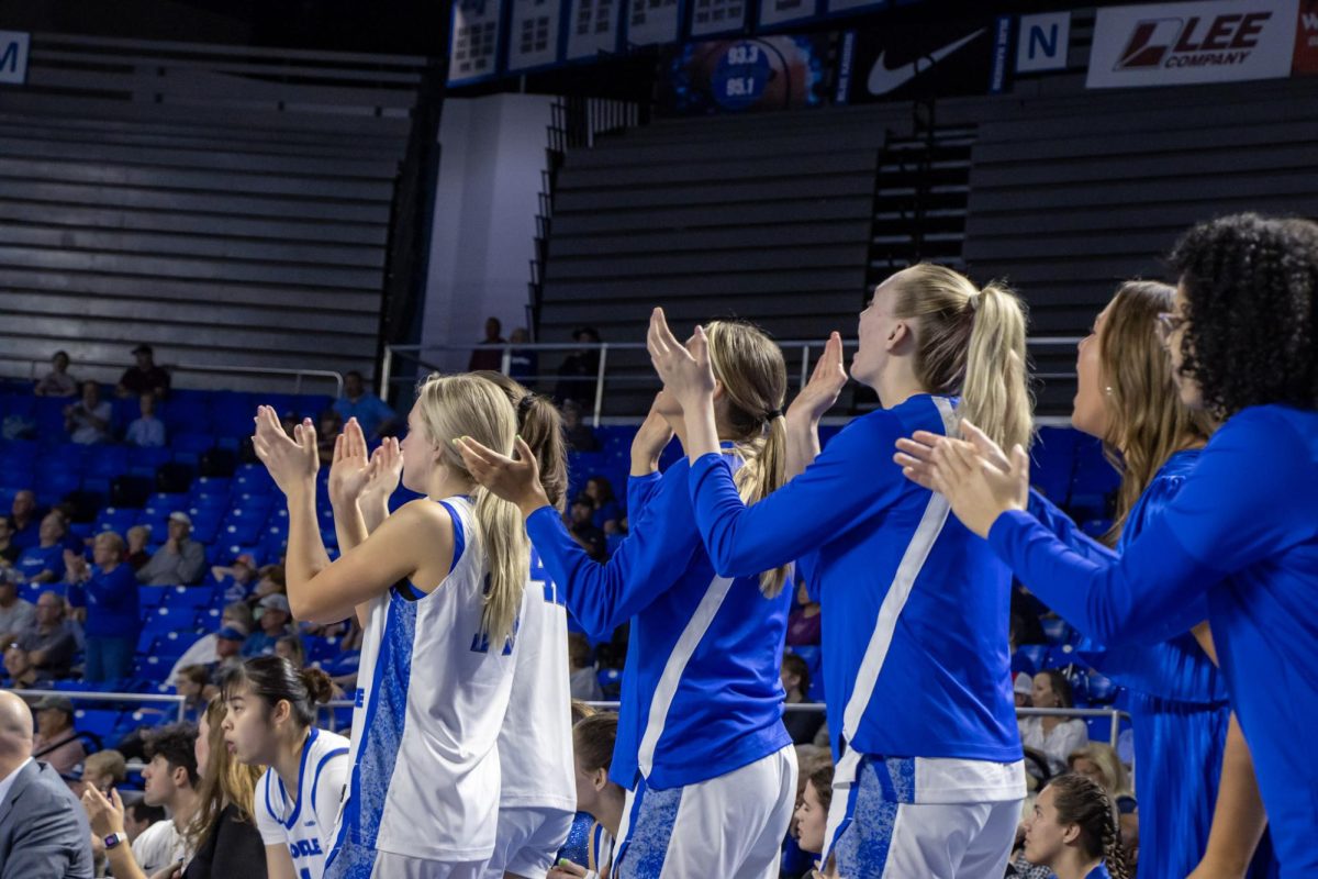 The MTSU bench cheering after a play in a game against Missouri State in the Murphy Center on March 7, 2026.