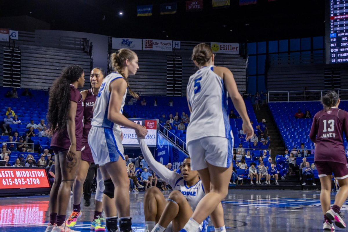 MTSU guards Blair Baugus (left) and Carsyn Swaney (right) help up Alayna Contreras during a game against Missouri State in the Murphy Center on March 7, 2026.