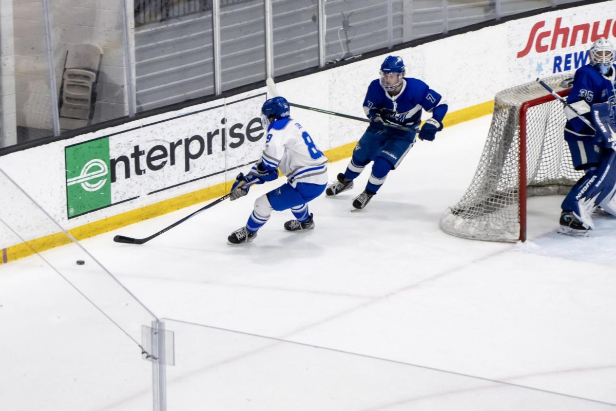 MTSU club hockey forward Ethan DeMumbrum races Grand Valley State defenseman Nolan Lenon during a game at the Centene Community Ice Center on March 20, 2026.