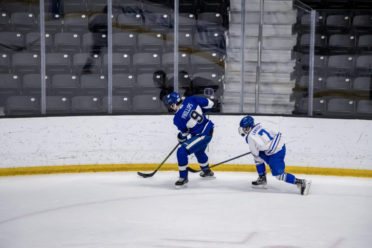 MTSU club hockey forward JJ Landers follows Grand Valley State defenseman Josh Phillips during a game at the Centene Community Ice Center on March 20, 2026.