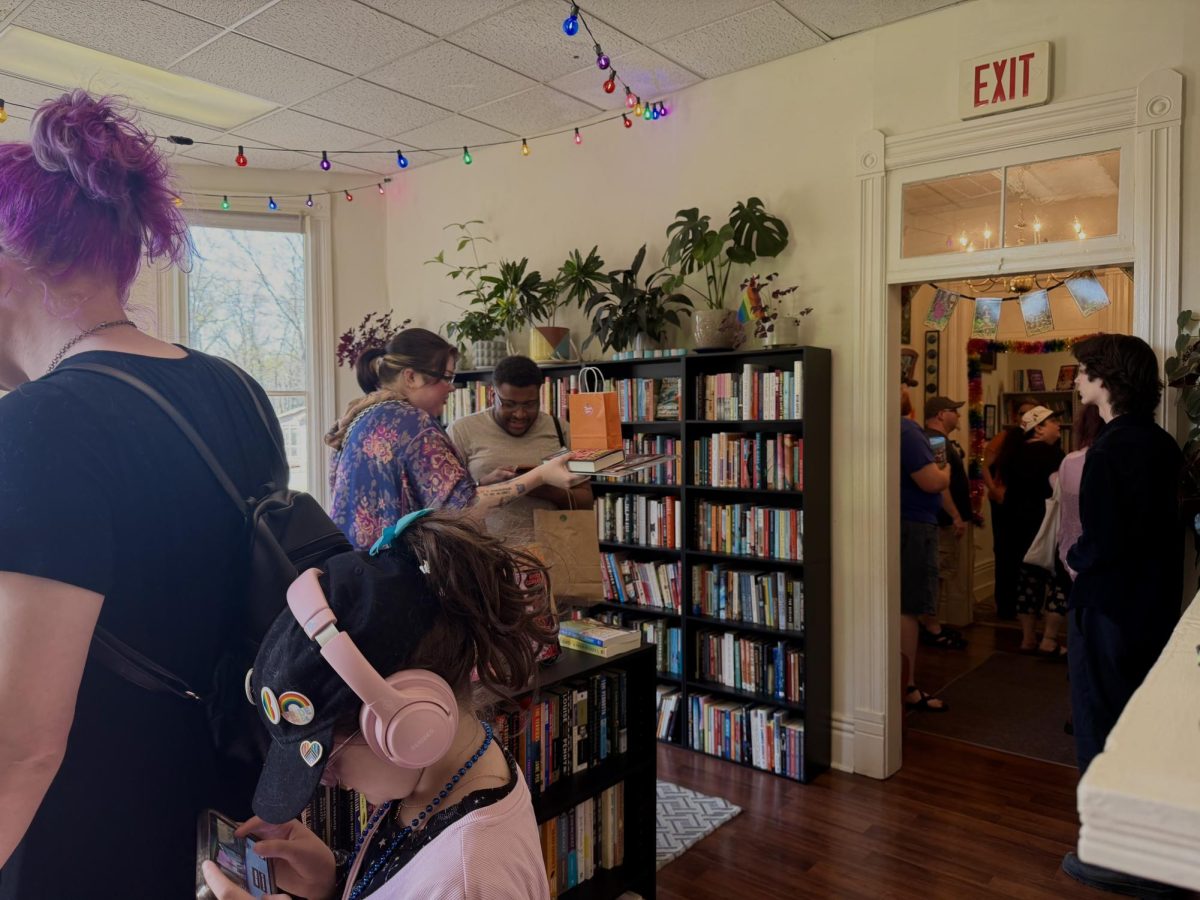 Patrons roam through the shelves at Crying Cat Books and Records on March 22, 2026.