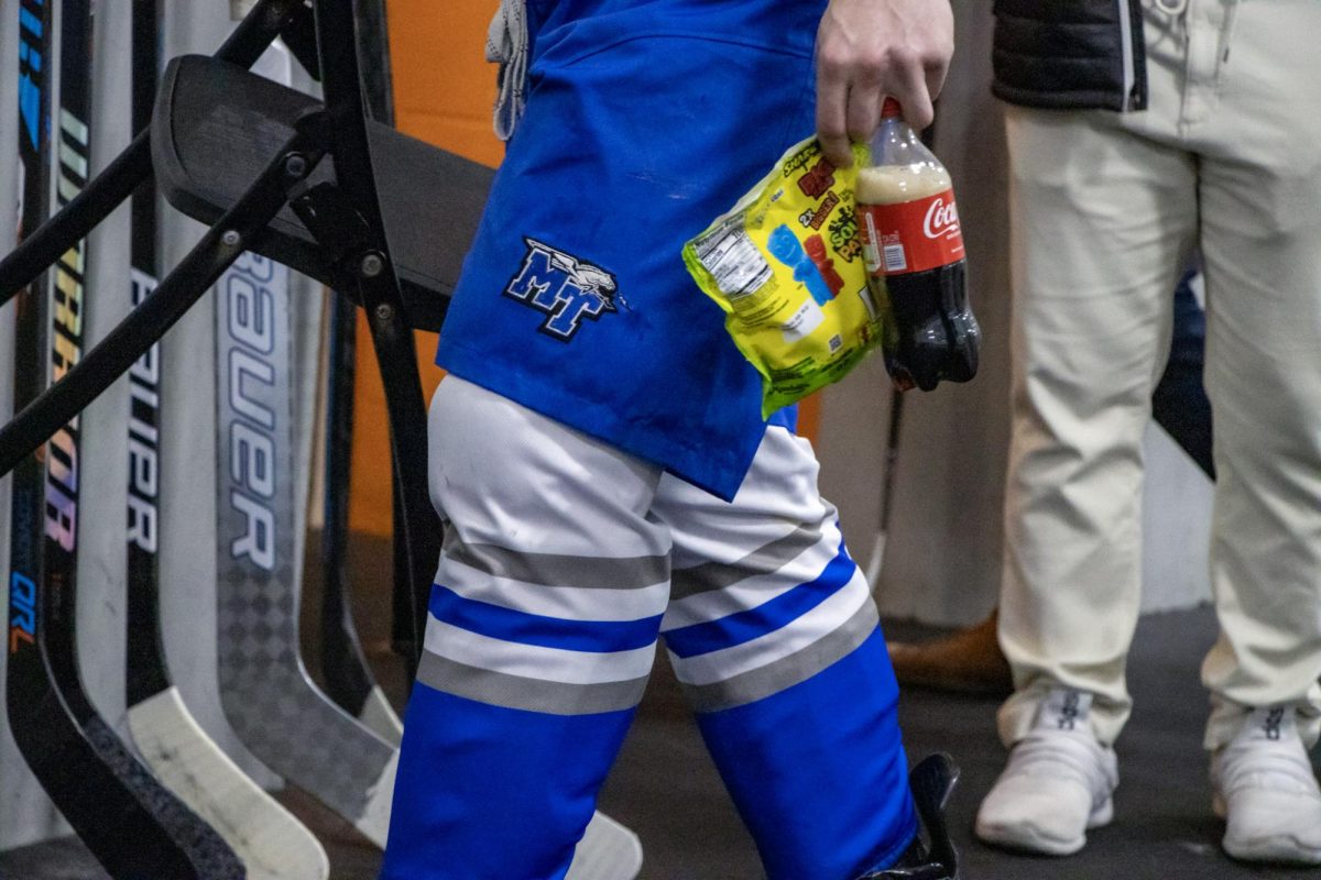 MTSU defensemen Aydin Suss grabs a snack during the intermission of a game against Northwood at the Centene Community Ice Center on March 19, 2026.