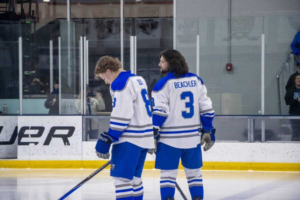 MTSU club hockey defensemen  (left) Aydin Suss and Justin Beachler (right) stand at the blue line during the line announcement before a game against Northwood at the Centene Community Ice Center on March 19, 2026.