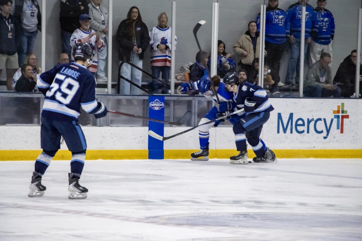 MTSU club hockey defenseman Justin Beachler playing through contact with Northwood forward Boston Bennett during a game at the Centene Community Ice Center on March 19, 2026.