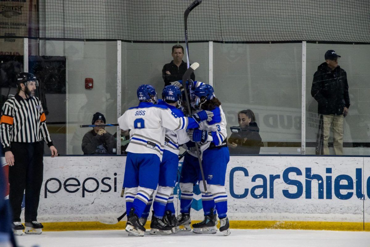 MTSU club hockey huddles to celebrate a goal against Northwood during a game at the Centene Community Ice Center on March 19, 2026.