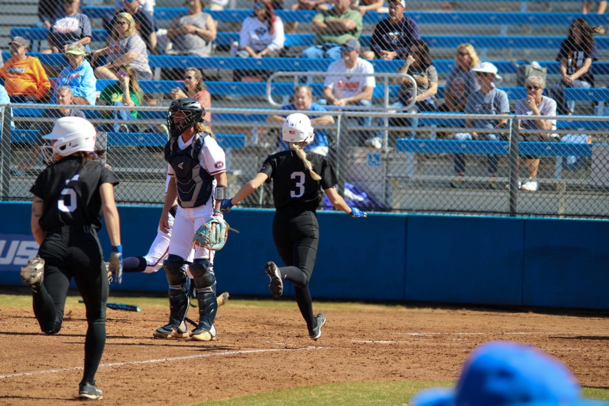 Macy Harter (5) and Lexi Medlock (3) score runs against UT Martin at Blue Raider Softball Field on Feb. 28, 2026.
