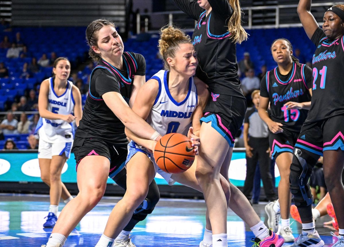 MTSU guard Gracie Hamby battles with two FIU defenders in the post during a game against Florida International University, inside the Murphy Center on March 5, 2026.