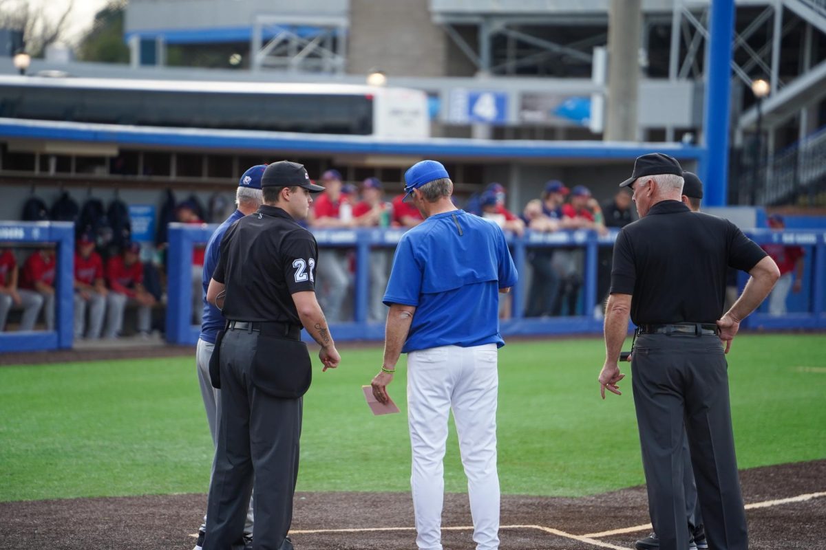  Middle Tennessee head coach Jerry Meyers meets with the opposing coach and umpires during a game against the Belmont Bruins baseball at Reese Smith Jr. Field on March 4, 2026.