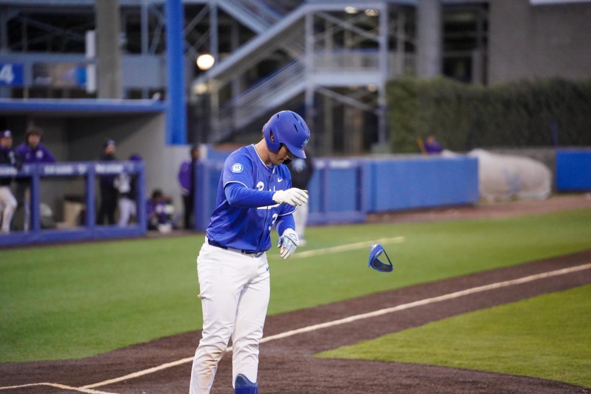 MTSU catcher Tyler Minnick removes his gear after drawing a walk during a game against Tennessee Tech University at Reese Smith Jr. field on Tuesday, Feb. 23, 2026.
