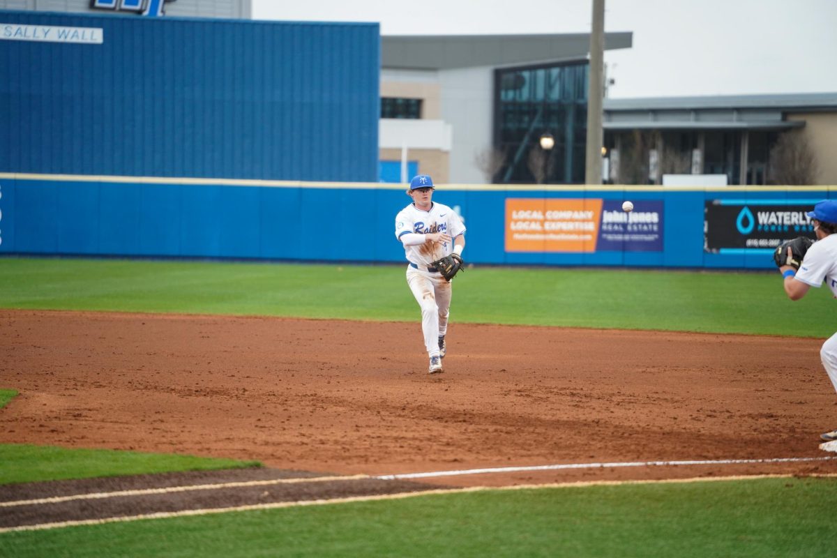 MTSU infielder Cooper Clapp flips the ball to first base to record the out against Eastern Kentucky University at Reese Smith Jr. Field on March 10, 2026.
