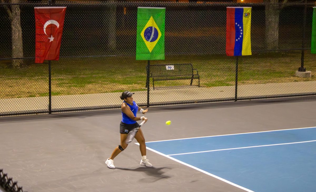  Sthefany Lima returning a shot against Bellarmine University at the MTSU Tennis Complex on Feb. 28, 2026.