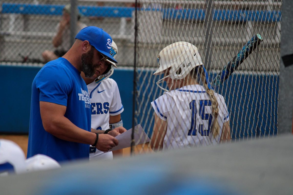  Middle Tennessee’s Lilly Pendergrast (15) and Avery Wynne (9) meet with
coach Bryce Brentz during their game against Louisiana Tech at Blue Raider Softball Field on
April 4, 2026.