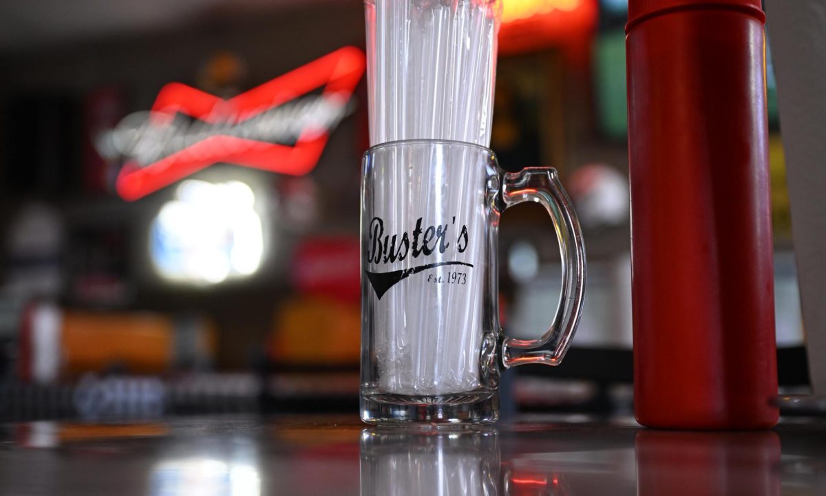 A glass mug filled with plastic straws inside Buster's Place on April 9, 2026. 