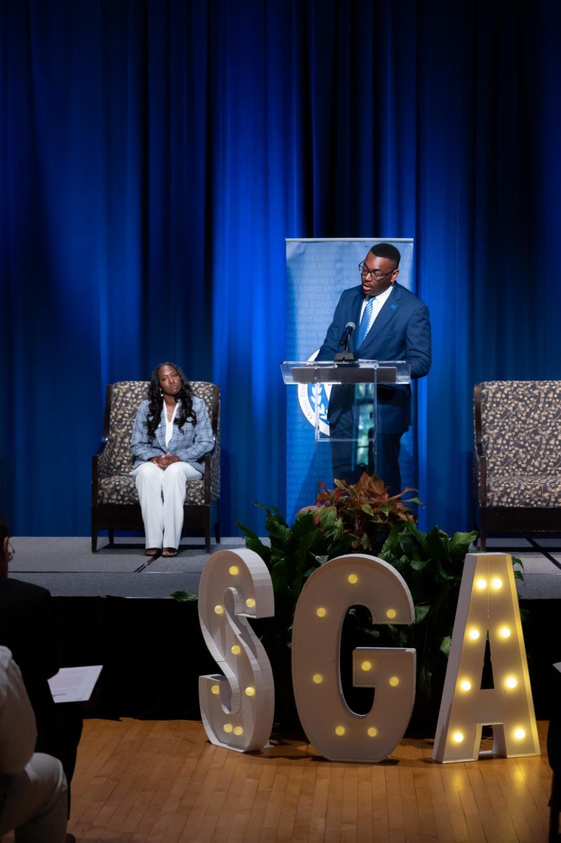 Incoming president Kennedy Garrett (left) and Outgoing president R.J. Ware (right)
on stage at the SGA inauguration in the James Union Building on Apr 23, 2026.